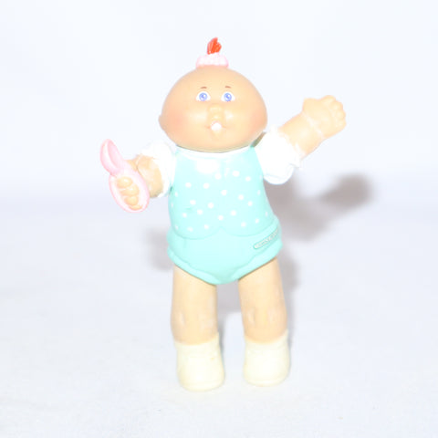 Cabbage Patch Kids Kid Holding a Pink Spoon