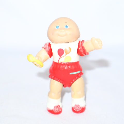 Cabbage Patch Kids Kid Holding a Yellow Spoon
