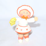 Cabbage Patch Kids Kid Holding a Yellow Teddy Bear